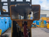 forklift mounted lifting hook attachment single pocket front view clamped to fork.